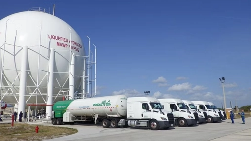 Liquefied hydrogen storage tank with tanker trucks at a US hydrogen supply facility